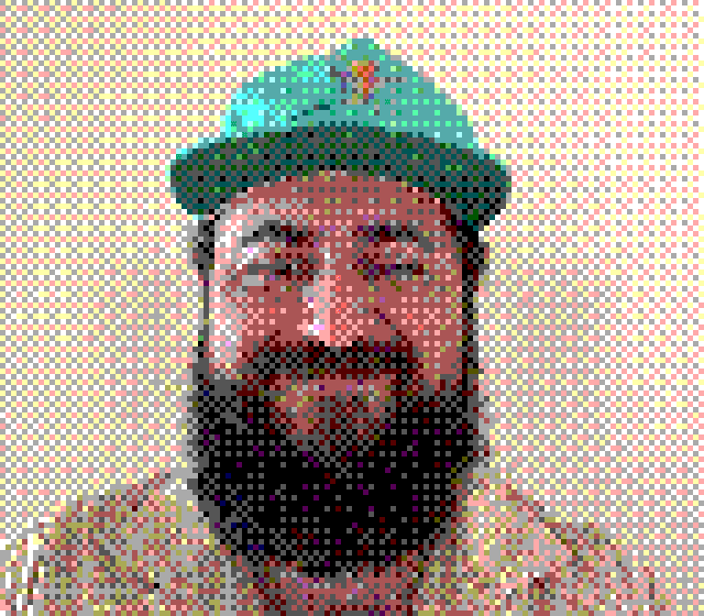 Dithered portrait of Tanner Godarzi wearing a green cap